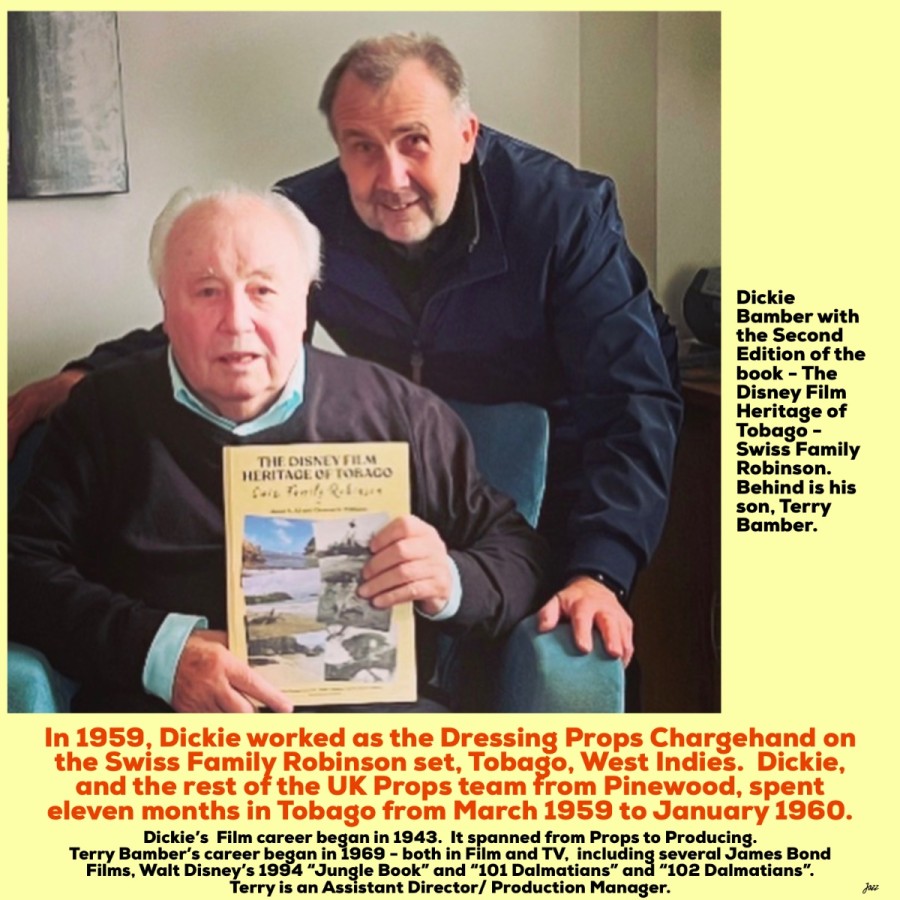 Dickie Bamber with the Second Edition of the book - The Disney Film Heritage of Tobago - Swiss Family Robinson.  Behind is his son, Terry Bamber.